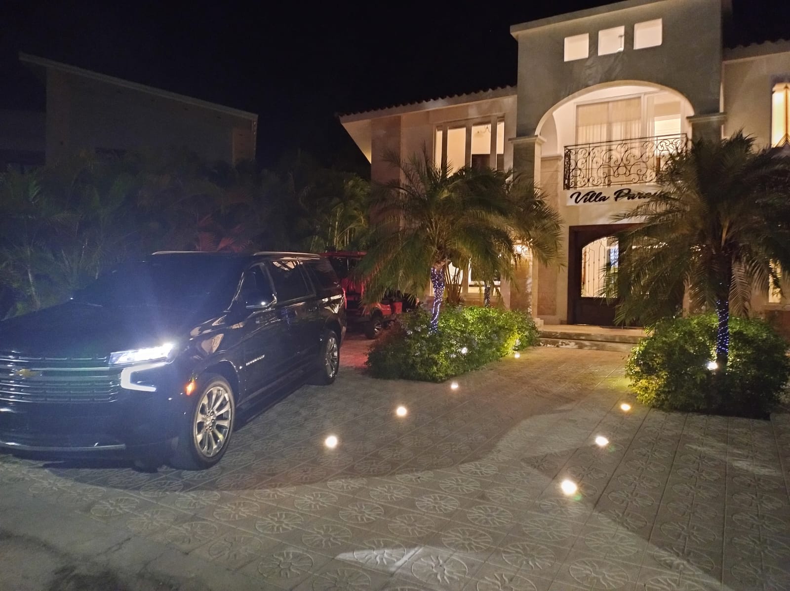 Luxury villa arrival at night with private transport